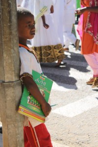 A young boy watching the parade down the main street of Harar..