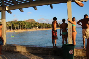 Locals hanging out on ‘the Wall’ with Diamond Head crater in the background..